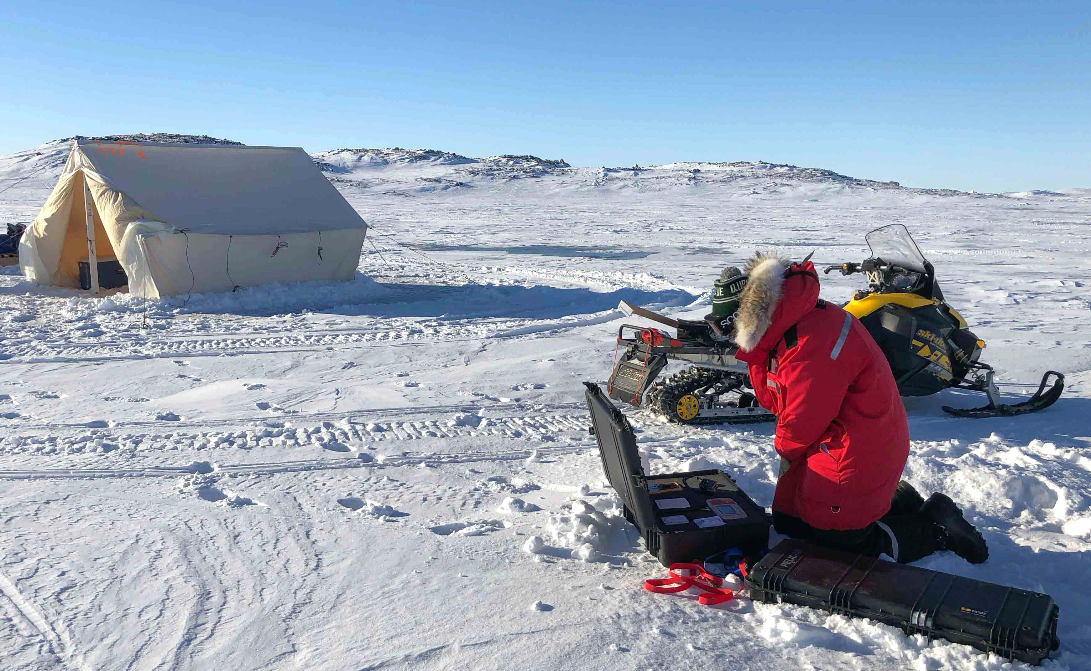 Sentinel North International Arctic Field School - Scientist deploying a sensor near Iqaluit